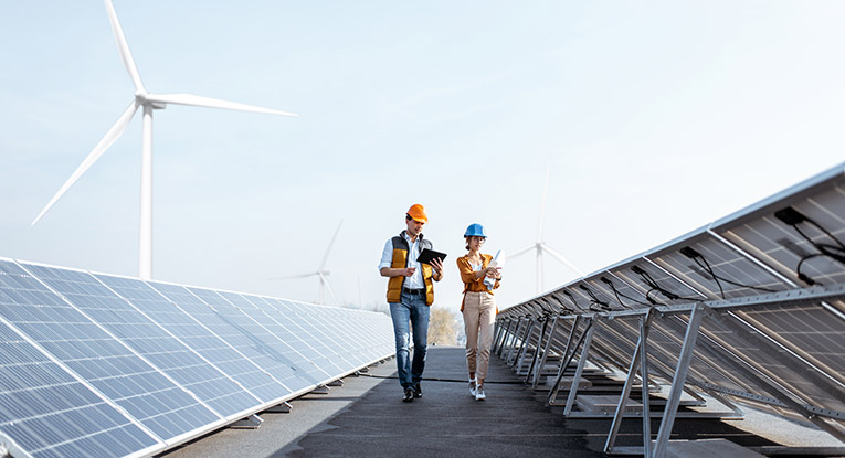 engineers walking on a solar panel roof